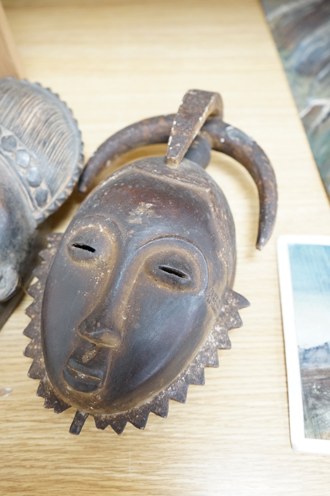 Three African carved hardwood masks, largest 39cm high. Condition - fair